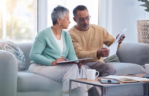 Two people comparing checklists